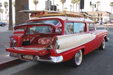 Photo shows very cool 1958 Edsel Roundup station wagon with surfboards on the wood roof rack