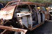 Straight 1957 Ford Country Squire station wagon project in vintage car junk yard