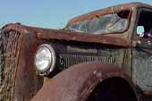 Vintage Dodge truck with great rust patina, parked in grassy field